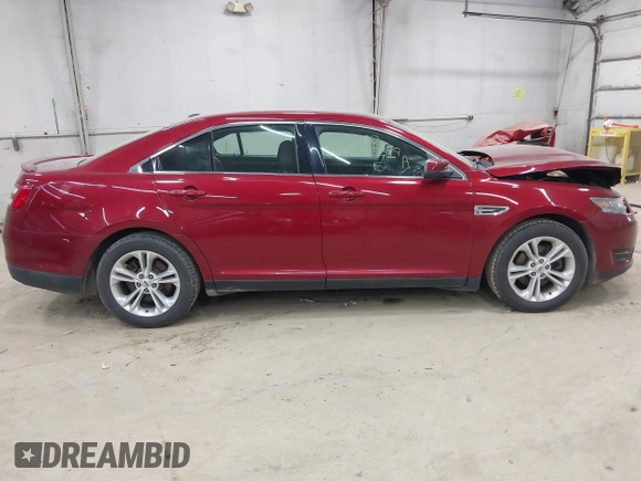 2015 Ford Taurus SEL z VIN 1FAHP2H88FG163179, wystawiony jako IAAI lot #42345579 z przebiegiem 142 424 mil mil oraz . Historia ofert i sprzedaży dostępna na DreamBid. Obrazek 13.