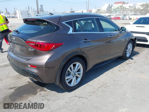 2018 Infiniti QX30 Premium with VIN SJKCH5CP5JA054091, listed as a IAAI auction lot 42471932 with 28,713 mi miles and . Bid and sale history available at DreamBid. Image 4.