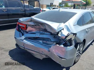 2020 Honda Accord with VIN 1HGCV3F11LA002534, listed as a IAAI auction lot 42537701 with 115,166 mi miles and . Bid and sale history available at DreamBid. Image 6.