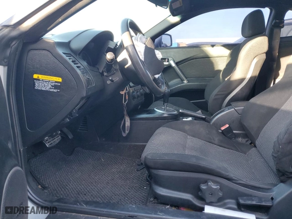 2004 Hyundai Tiburon GT with VIN KMHHN65F44U130202, listed as a Copart auction lot 43193404 with 207,694 mi miles and Salvage Title. Bid and sale history available at carsss.com. Image 7.