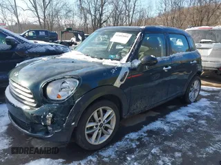 2013 MINI Countryman with VIN WMWZB3C53DWM08700, listed as a IAAI auction lot 41402093 with 71,109 mi miles and . Bid and sale history available at DreamBid. Image 2.