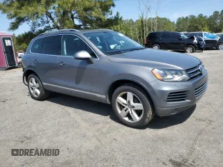 2012 Volkswagen Touareg Sport with VIN WVGEF9BP0CD010197, listed as a Copart auction lot 48480355 with 131,605 mi miles and Salvage Title. Bid and sale history available at DreamBid. Image 4.
