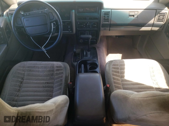 1994 Jeep Grand Cherokee Laredo with VIN 1J4GZ58Y7RC113333, listed as a Copart auction lot 57995734 with 220,950 mi miles and Clean Title. Bid and sale history available at carsss.com. Image 8.