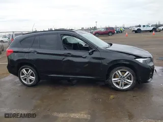 2021 BMW X1 xDrive28i with VIN WBXJG9C01M3M71033, listed as a IAAI auction lot 41723970 with 71,000 mi miles. Bid and sale history available at carsss.com. Image 13.