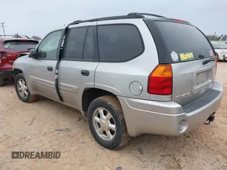 2005 GMC Envoy SLT with VIN 1GKDT13S452263166, listed as a IAAI auction lot 41543466 with 166,999 mi miles. Bid and sale history available at carsss.com. Image 3.