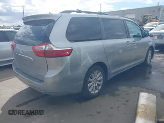 2015 Toyota Sienna XLE with VIN 5TDYK3DC2FS640204, listed as a IAAI auction lot 41772349 with 104,156 mi miles. Bid and sale history available at carsss.com. Image 4.