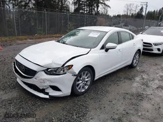 2016 Mazda Mazda6 i Sport with VIN JM1GJ1U52G1431967, listed as a IAAI auction lot 41602804 with 130,579 mi miles. Bid and sale history available at carsss.com. Image 2.