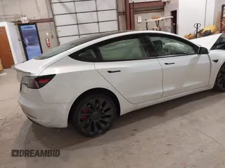 2021 Tesla Model 3 Performance with VIN 5YJ3E1ECXMF991836, listed as a IAAI auction lot 41830519 with Not Provided miles and . Bid and sale history available at carsss.com. Image 4.