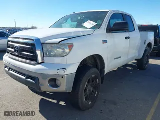 2010 Toyota Tundra 4WD Truck with VIN 5TFUW5F16AX102070, listed as a IAAI auction lot 41603206 with 214,742 mi miles. Bid and sale history available at carsss.com. Image 2.