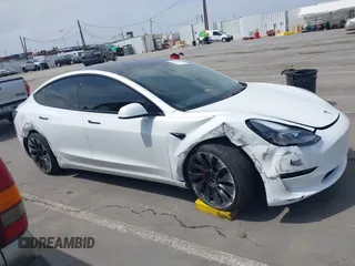 2021 Tesla Model 3 Performance with VIN 5YJ3E1EC2MF084594, listed as a IAAI auction lot 42030339 with 43,215 mi miles and . Bid and sale history available at DreamBid. Image 13.