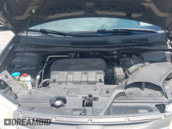 2012 Honda Odyssey Touring with VIN 5FNRL5H90CB088536, listed as a IAAI auction lot 42102008 with 283,350 mi miles and . Bid and sale history available at DreamBid. Image 10.