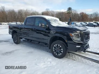 2024 Nissan Titan XD PRO-4X with VIN 1N6AA1FB1RN112626, listed as a Copart auction lot 81987324 with 0 mi miles and Salvage Title. Bid and sale history available at carsss.com. Image 4.