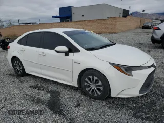 2021 Toyota Corolla Hybrid LE with VIN JTDEAMDE3MJ013373, listed as a Copart auction lot 48709785 with 136,422 mi miles and Salvage Title. Bid and sale history available at carsss.com. Image 4.