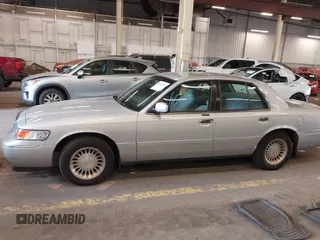 2000 Mercury Grand Marquis LS z VIN 2MEFM75W0YX736324, wystawiony jako IAAI lot #41865927 z przebiegiem 136 886 mil mil oraz . Historia ofert i sprzedaży dostępna na DreamBid. Obrazek 14.