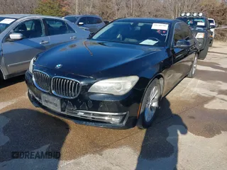 2013 BMW 7 Series 740i with VIN WBAYA6C55DC995094, listed as a IAAI auction lot 41246796 with 164,394 mi miles. Bid and sale history available at carsss.com. Image 2.