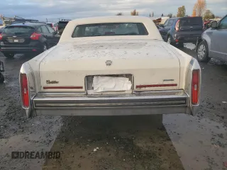 1988 Cadillac Brougham z VIN 1G6DW51Y1JR761749, wystawiony jako Copart lot #80371494 z przebiegiem 1271 mil mil oraz Tytuł czysty. Historia ofert i sprzedaży dostępna na DreamBid. Obrazek 6.