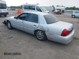 2003 Mercury Grand Marquis LS Premium z VIN 2MEFM75W03X658118, wystawiony jako IAAI lot #42435812 z przebiegiem 174 893 mil mil oraz . Historia ofert i sprzedaży dostępna na DreamBid. Obrazek 3.