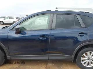2015 Mazda CX-5 Touring with VIN JM3KE2CY5F0449195, listed as a IAAI auction lot 41894567 with 124,694 mi miles and . Bid and sale history available at DreamBid. Image 14.