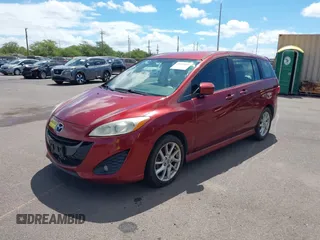 2012 Mazda 5 Touring with VIN JM1CW2CLXC0113181, listed as a IAAI auction lot 42653061 with 94,441 mi miles and . Bid and sale history available at DreamBid. Image 2.