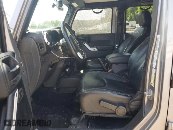 2014 Jeep Wrangler Unlimited Sahara with VIN 1C4BJWEG8EL236951, listed as a Copart auction lot 61046575 with 146,642 mi miles and Salvage title. Bid and sale history available at DreamBid. Image 7.