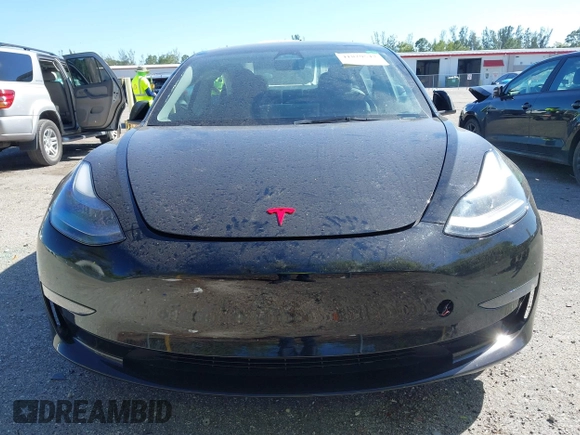 2023 Tesla Model 3 with VIN 5YJ3E1EAXPF623403, listed as a IAAI auction lot 41829543 with 29,414 mi miles and . Bid and sale history available at carsss.com. Image 13.