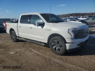 2023 Ford F-150 Lightning Pro with VIN 1FTVW1EV5PWG43000, listed as a Copart auction lot 42684545 with 16,646 mi miles and Salvage Title. Bid and sale history available at carsss.com. Image 4.