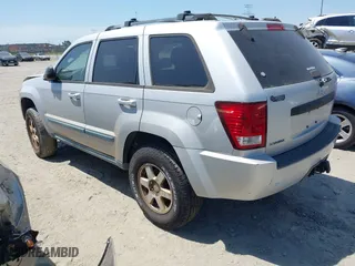 2008 Jeep Grand Cherokee Laredo with VIN 1J8GS48K28C161376, listed as a IAAI auction lot 42048390 with 206,679 mi miles. Bid and sale history available at carsss.com. Image 3.