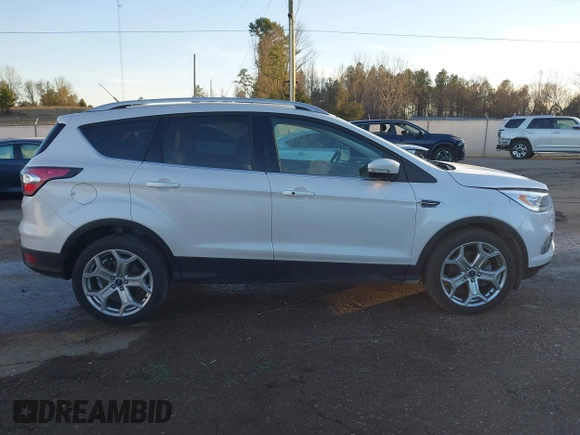 2017 Ford Escape Titanium with VIN 1FMCU0J98HUA75690, listed as a IAAI auction lot 41358534 with 90,376 mi miles. Bid and sale history available at carsss.com. Image 14.