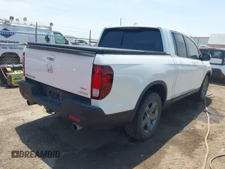 2023 Honda Ridgeline RTL z VIN 5FPYK3F51PB028295, wystawiony jako IAAI lot #42031783 z przebiegiem 39 228 mil mil oraz . Historia ofert i sprzedaży dostępna na DreamBid. Obrazek 4.