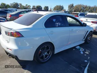 2012 Mitsubishi Lancer Evolution MR with VIN JA32W5FV3CU009679, listed as a IAAI auction lot 40787549 with 167,206 mi miles. Bid and sale history available at carsss.com. Image 4.