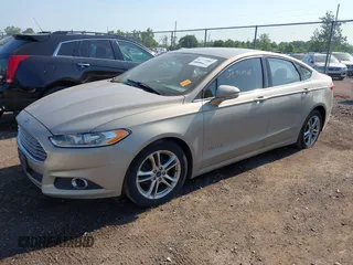 2015 Ford Fusion SE Hybrid with VIN 3FA6P0LU7FR243498, listed as a IAAI auction lot 42719986 with 345,098 mi miles and . Bid and sale history available at DreamBid. Image 2.