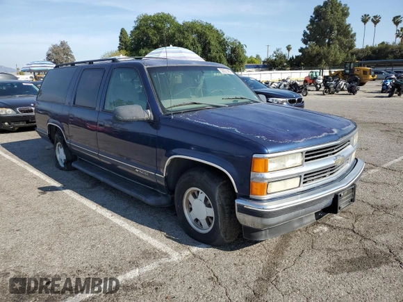 1999 Chevrolet Suburban with VIN 3GNEC16RXXG254126, listed as a Copart auction lot 52051405 with 113,554 mi miles and Clean title. Bid and sale history available at DreamBid. Image 4.