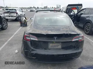 2019 Tesla Model 3 Mid Range with VIN 5YJ3E1EA2KF362048, listed as a IAAI auction lot 40141734 with 70,321 mi miles and . Bid and sale history available at carsss.com. Image 15.
