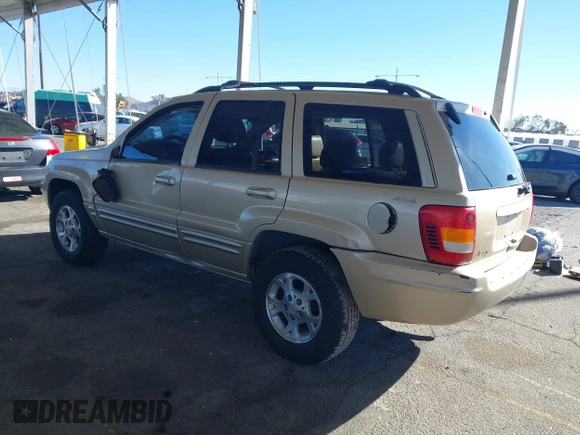 1999 Jeep Grand Cherokee Limited with VIN 1J4GW68NXXC727844, listed as a IAAI auction lot 41290773 with 222,838 mi miles. Bid and sale history available at carsss.com. Image 3.
