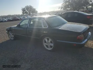 2003 Jaguar XJ with VIN SAJDA12C63LF56705, listed as a Copart auction lot 81903784 with 0 mi miles and Salvage Title. Bid and sale history available at carsss.com. Image 2.