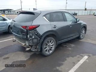 2020 Mazda CX-5 Grand Touring with VIN JM3KFBDM4L0829861, listed as a IAAI auction lot 41826250 with 62,091 mi miles and . Bid and sale history available at carsss.com. Image 4.
