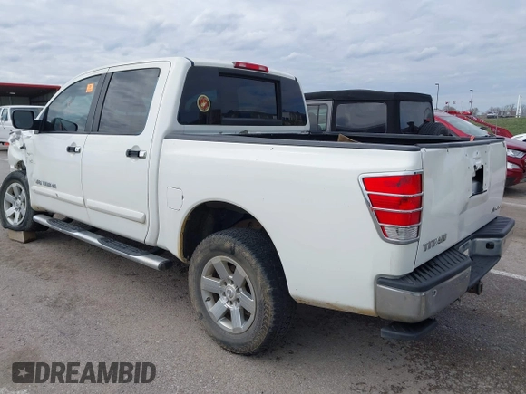 2011 Nissan Titan SL with VIN 1N6AA0EC7BN313599, listed as a IAAI auction lot 41888934 with 182,894 mi miles. Bid and sale history available at carsss.com. Image 3.