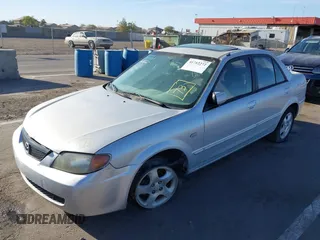 2002 Mazda Protege DX with VIN JM1BJ225X20639872, listed as a IAAI auction lot 41712272 with 145,118 mi miles and . Bid and sale history available at DreamBid. Image 2.