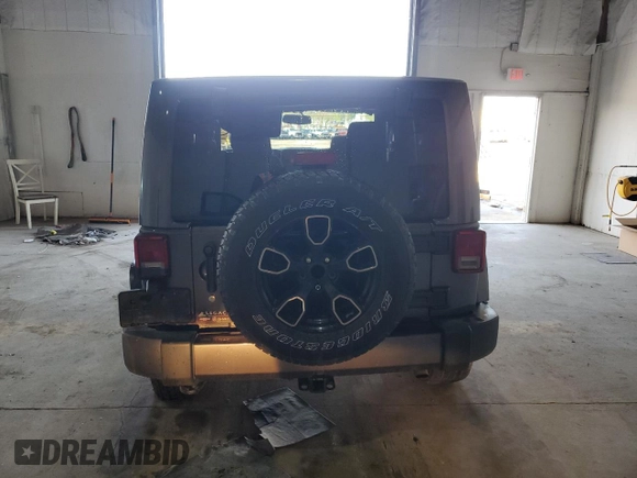 2017 Jeep Wrangler Sahara z VIN 1C4AJWBG6HL582839, wystawiony jako Copart lot #52049725 z przebiegiem 143 544 mil mil oraz Szkoda całkowita • Salvage title. Historia ofert i sprzedaży dostępna na DreamBid. Obrazek 6.