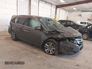 2014 Honda Odyssey Touring with VIN 5FNRL5H99EB105059, listed as a IAAI auction lot 42457672 with 240,581 mi miles and . Bid and sale history available at DreamBid. Image 1.