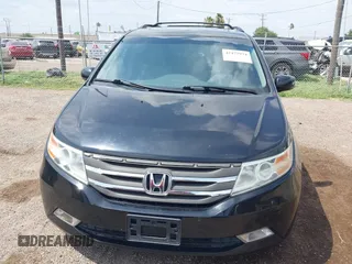 2013 Honda Odyssey Touring with VIN 5FNRL5H95DB086041, listed as a IAAI auction lot 42477974 with 213,343 mi miles and . Bid and sale history available at DreamBid. Image 6.
