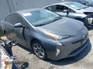 2016 Toyota Prius Four z VIN JTDKARFU1G3003700, wystawiony jako IAAI lot #42116805 z przebiegiem 184 670 mil mil oraz . Historia ofert i sprzedaży dostępna na DreamBid. Obrazek 1.