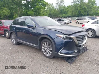 2021 Mazda CX-9 Carbon Edition with VIN JM3TCBDY7M0536005, listed as a IAAI auction lot 42424129 with 48,005 mi miles and . Bid and sale history available at DreamBid. Image 1.