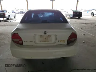 2001 Nissan Maxima GXE with VIN JN1CA31D41T809212, listed as a Copart auction lot 57845405 with 244,502 mi miles and Salvage title. Bid and sale history available at DreamBid. Image 6.