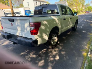 2017 Nissan Titan SV with VIN 1N6AA1EK5HN530011, listed as a Copart auction lot 57471455 with 216,992 mi miles and Clean title. Bid and sale history available at DreamBid. Image 4.