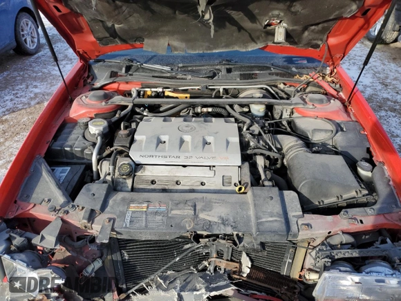 2002 Cadillac Eldorado z VIN 1G6EC12972B106132, wystawiony jako Copart lot #86799624 z przebiegiem 75 334 mil mil oraz Szkoda całkowita • Salvage title. Historia ofert i sprzedaży dostępna na DreamBid. Obrazek 11.