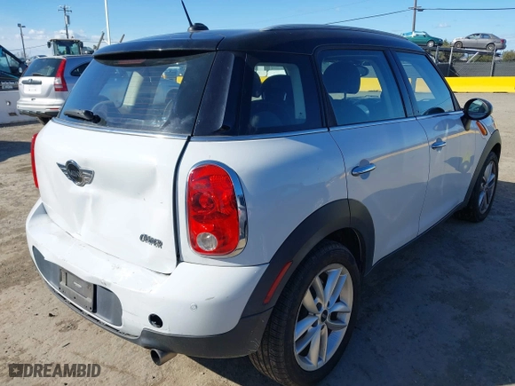 2013 MINI Cooper Countryman with VIN WMWZB3C51DWM31277, listed as a IAAI auction lot 41506486 with 79,006 mi miles. Bid and sale history available at carsss.com. Image 4.