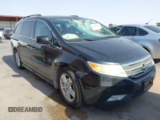 2013 Honda Odyssey Touring with VIN 5FNRL5H97DB074876, listed as a IAAI auction lot 42488471 with 108,140 mi miles and . Bid and sale history available at DreamBid. Image 1.