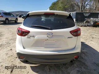2016 Mazda CX-5 Grand Touring with VIN JM3KE4DY6G0857197, listed as a Copart auction lot 44500955 with 76,088 mi miles and Salvage Title. Bid and sale history available at DreamBid. Image 6.