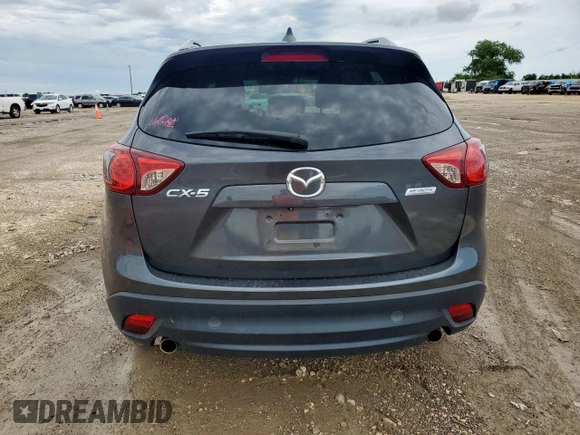 2014 Mazda CX-5 Touring z VIN JM3KE2CY7E0308580, wystawiony jako Copart lot #60565835 z przebiegiem 92 708 mil mil oraz Szkoda całkowita • Salvage title. Historia ofert i sprzedaży dostępna na DreamBid. Obrazek 6.